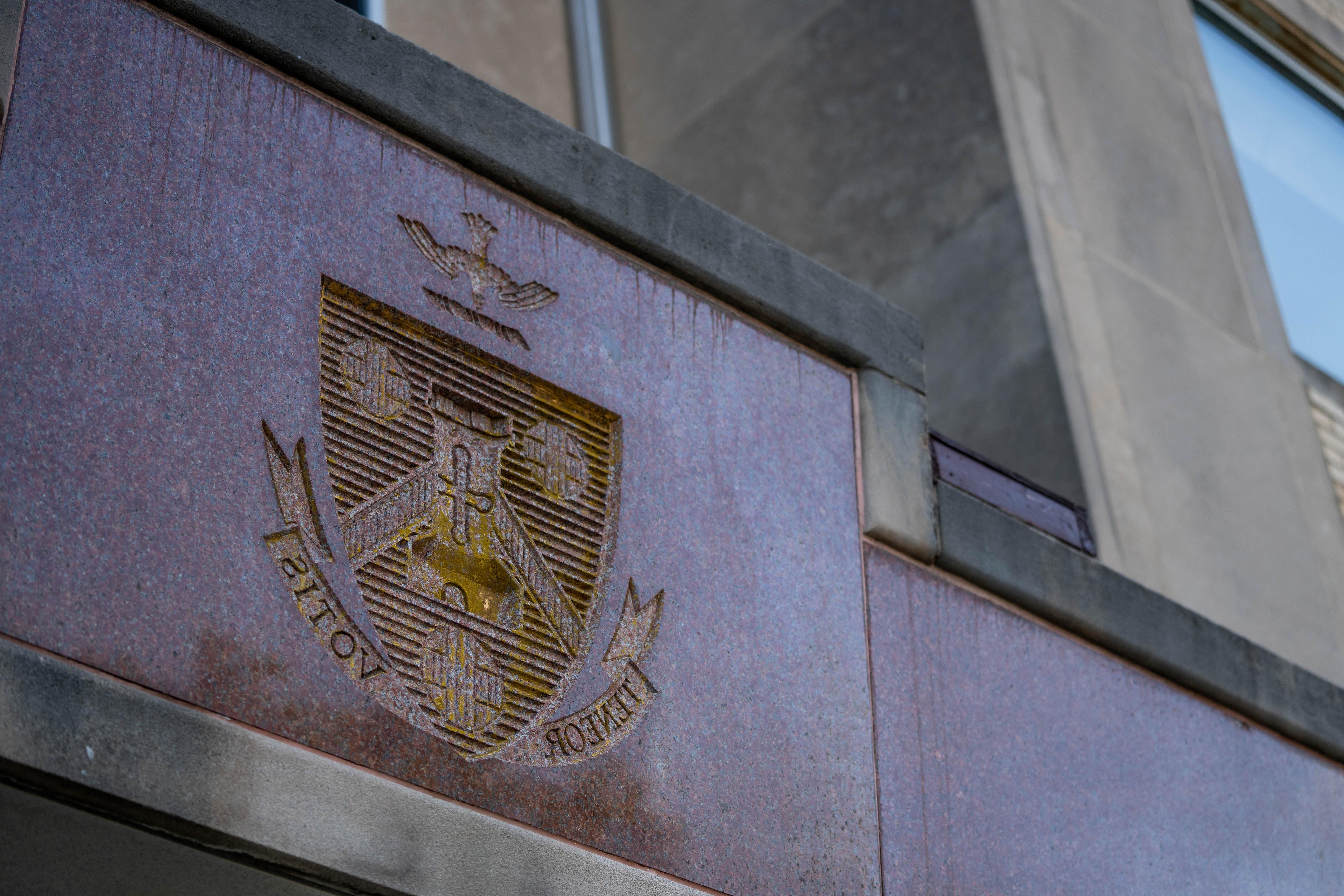 Holy Family University shield with teneor votis motto on Holy Family Hall